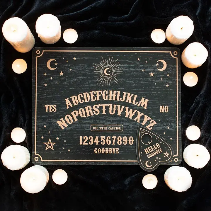 Black talking board with planchette
