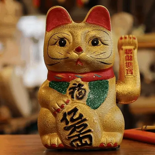 Maneki Neko lucky money cat with a waving left hand