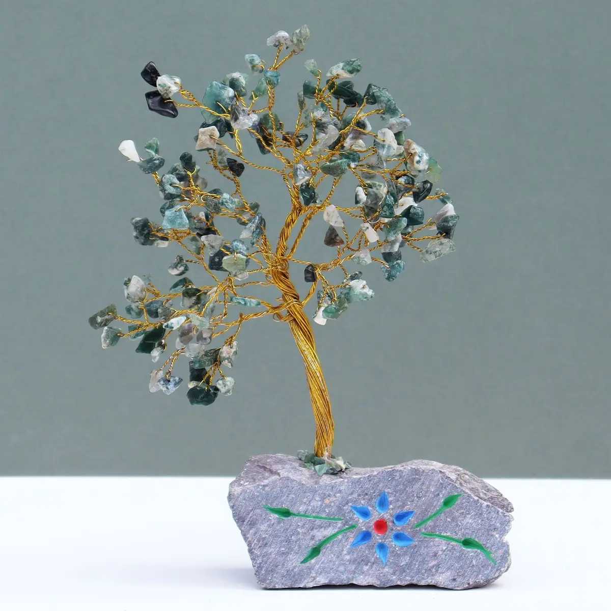 Moss agate gemstone tree on a gemstone rock base