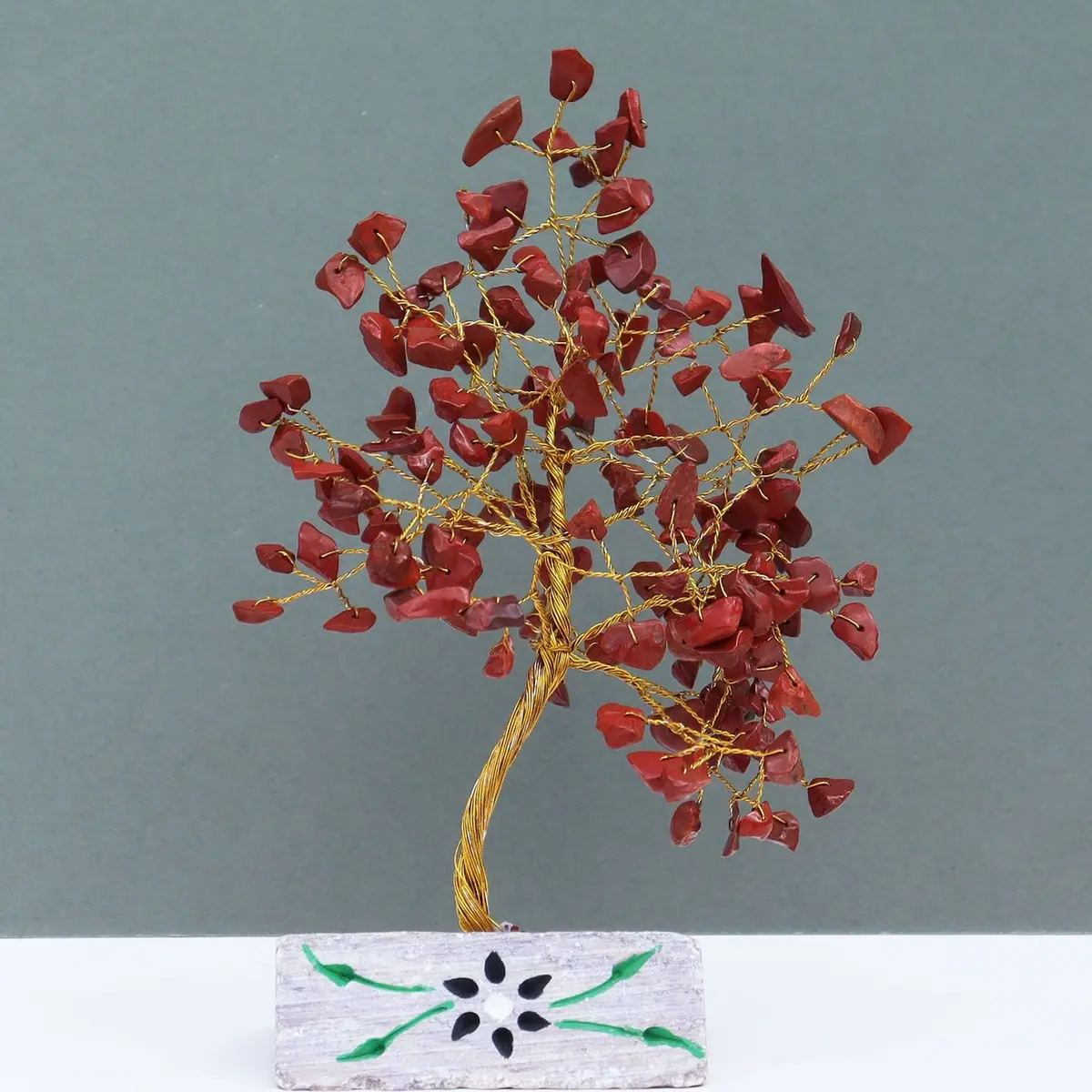 Red jasper gemstone tree on a gemstone rock base
