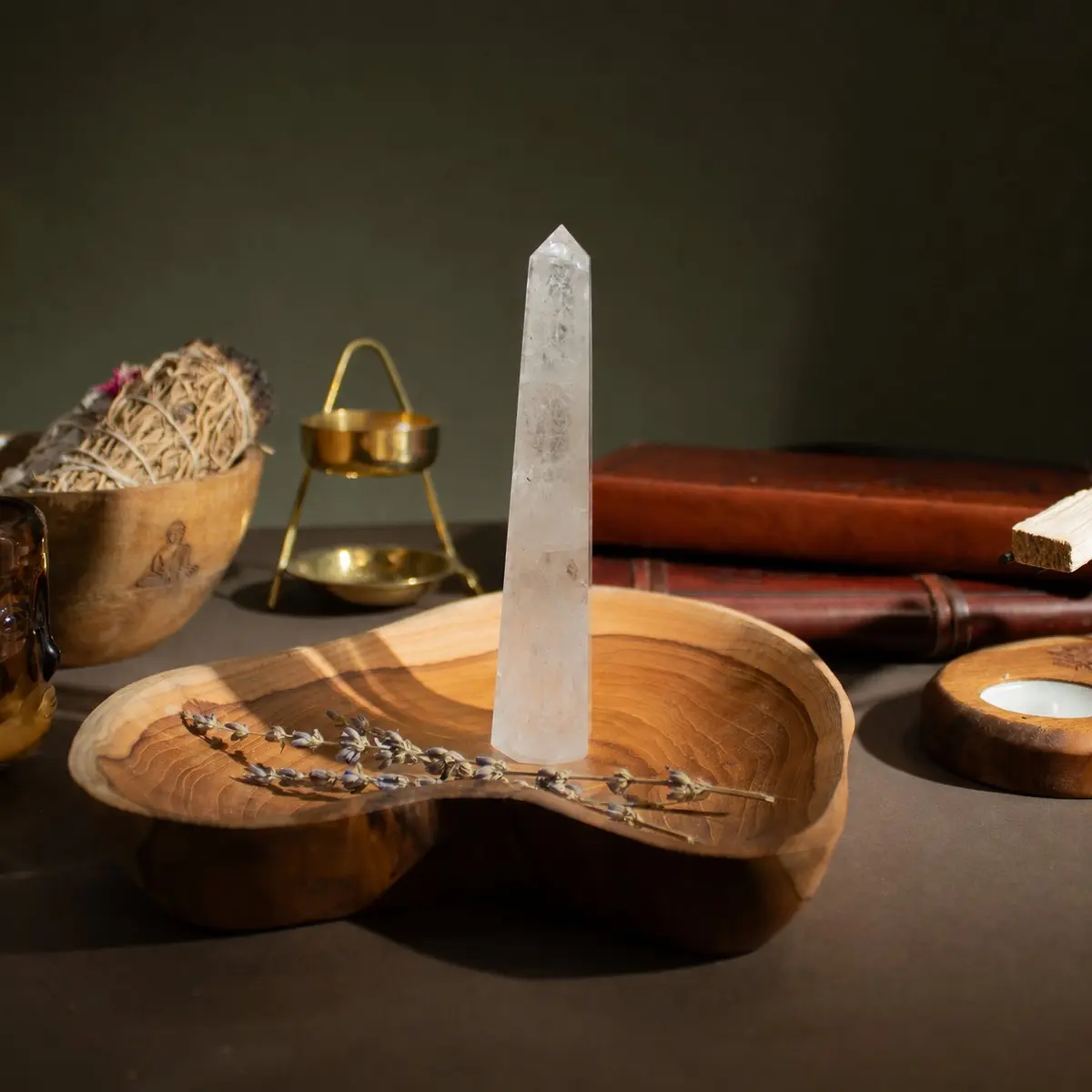 Polished clear rock crystal obelisk point with six faces