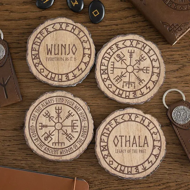 Set of four wood slice coasters with Viking-inspired runes and symbols