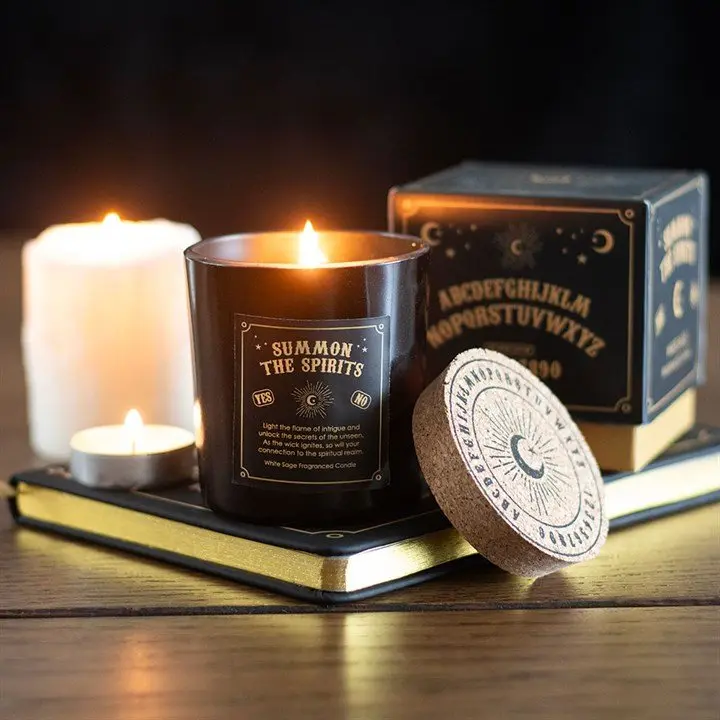 White sage candle in glass with spirit board inspired design